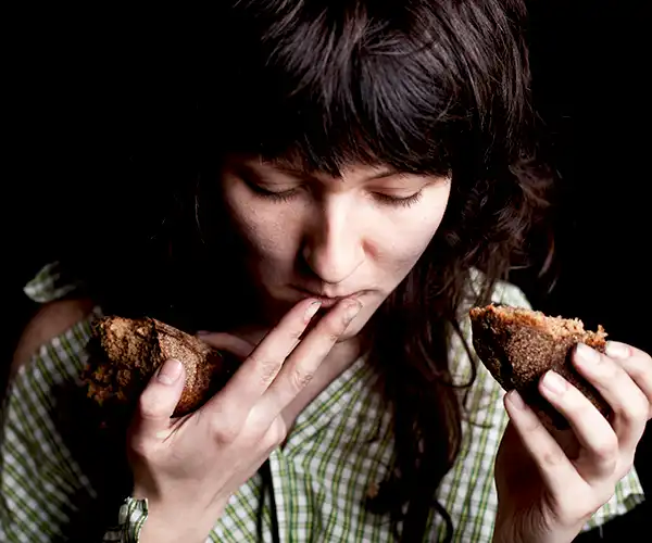 Young female eating who may have bulimia