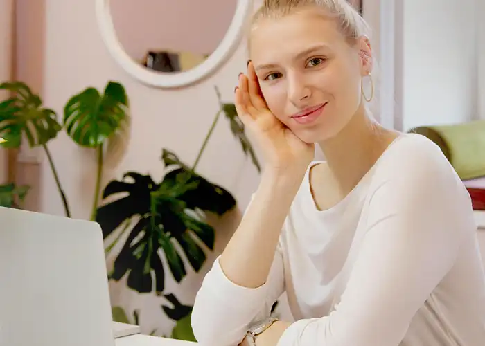 Young female sitting in front of a laptop