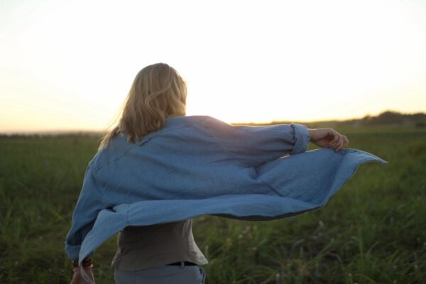 Woman walking outdoors with confidence after trauma recovery through EMDR therapy